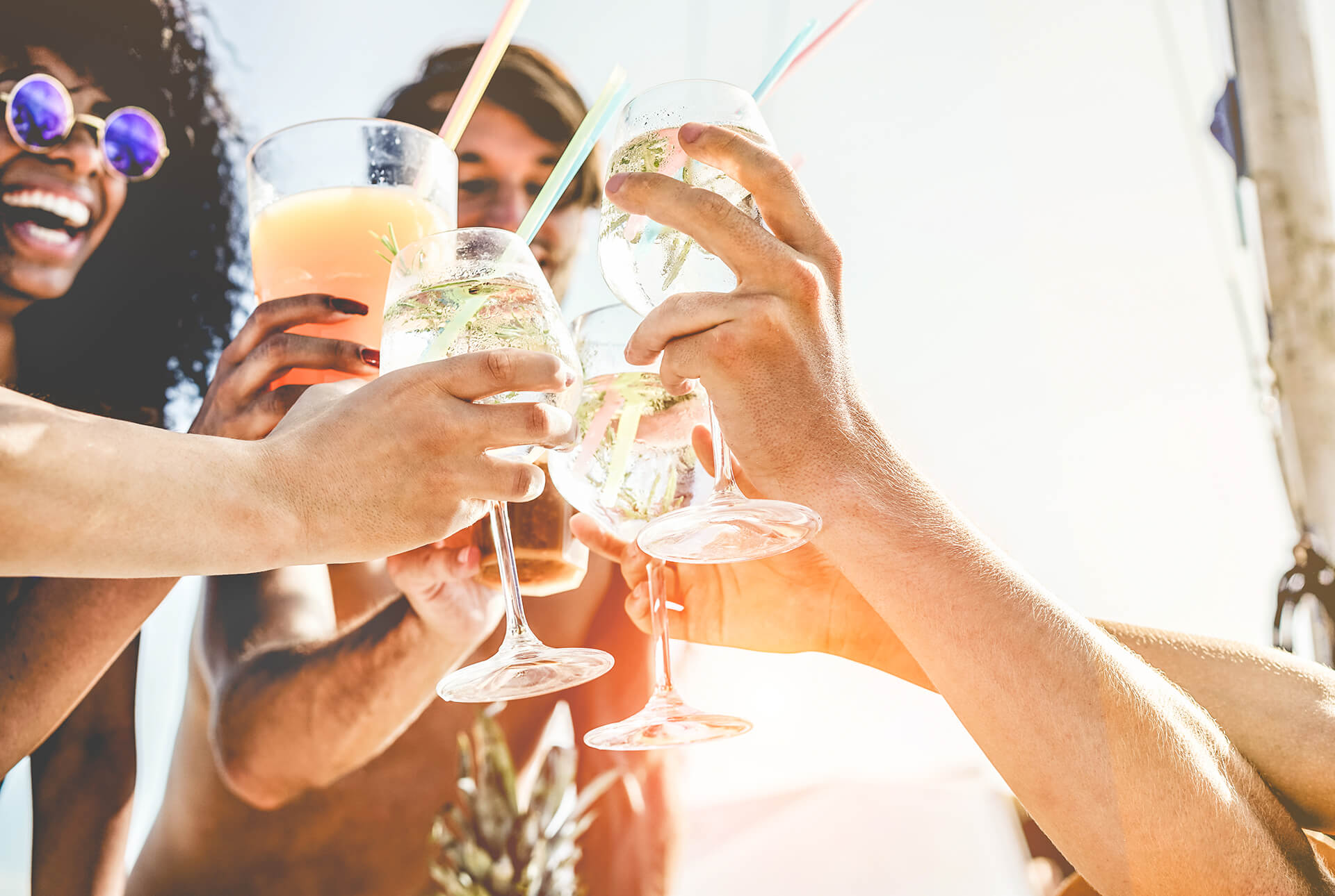 Festival with a bunch of people holding a cocktail